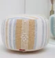Decorative pouf for living room with stylish design, soft comfort, and versatile functionality.
