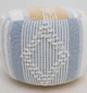 Decorative pouf for living room with stylish design, soft comfort, and versatile functionality.