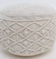 Decorative pouf for living room with stylish design, soft comfort, and versatile functionality.