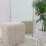 Decorative pouf for living room with stylish design, soft comfort, and versatile functionality.