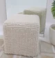 Decorative pouf for living room with stylish design, soft comfort, and versatile functionality.