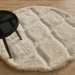 White round shaggy rug with soft plush texture, modern design, and cozy comfort for home décor.