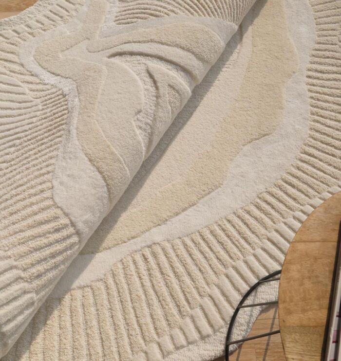 Handmade rug crafted with artisanal skill, offering unique design, warmth, and lasting durability.
