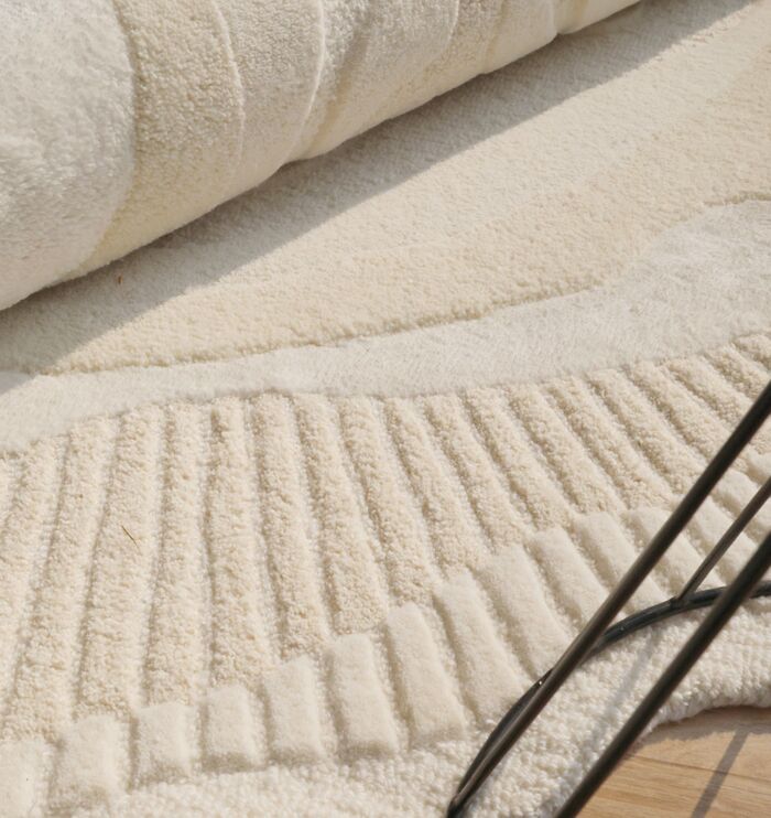Handmade rug crafted with artisanal skill, offering unique design, warmth, and lasting durability.