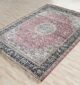 Machine-made rug featuring durable construction, stylish patterns, and easy-care design for modern homes.