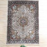 Upgrade your space with the durability and elegance of this machine-made rug.