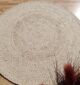 Round jute carpet for living room and bedroom, designed in a modern carpet style to suit home décor in Dubai.
