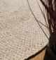 Round jute carpet for living room and bedroom, designed in a modern carpet style to suit home décor in Dubai.