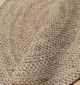 Round jute carpet for living room and bedroom, designed in a modern carpet style to suit home décor in Dubai.