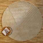 Round jute carpet for living room and bedroom, designed in a modern carpet style to suit home décor in Dubai.