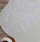 Round jute carpet for living room and bedroom, designed in a modern carpet style to suit home décor in Dubai.