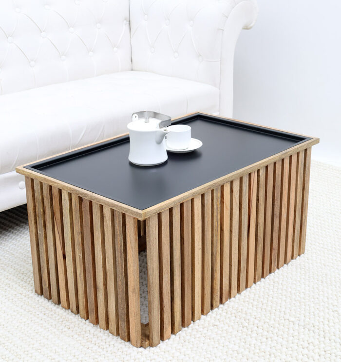 Angled side view of modern wooden and iron coffee table with square slatted design