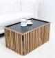 Angled side view of modern wooden and iron coffee table with square slatted design