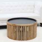 Straight side view of modern round wooden and iron coffee table with slatted design GH-093