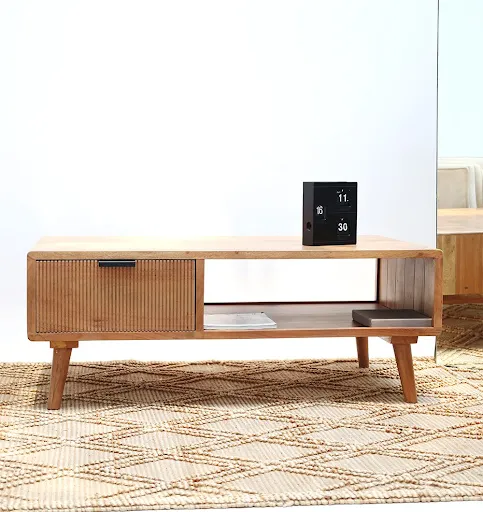 Wooden sideboard placed on natural jute rug in modern interior