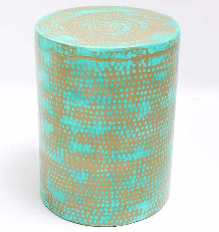Round modern coffee table with turquoise dot pattern and golden iron base – vibrant minimalist design