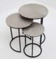 Modern round coffee table with aluminium top and black iron legs – minimalist industrial design