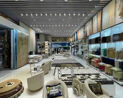 Showroom filled with handmade rugs, poufs, and cushions – Best Rugs Manufacturers in the UAE
