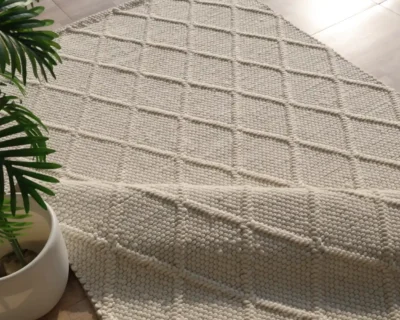 High-quality custom handmade rug being crafted, illustrating durability and skilled artistry for rug investment guide