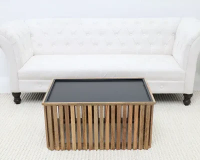 Side table positioned in front of a sofa demonstrating ideal height and sizing for living room furniture